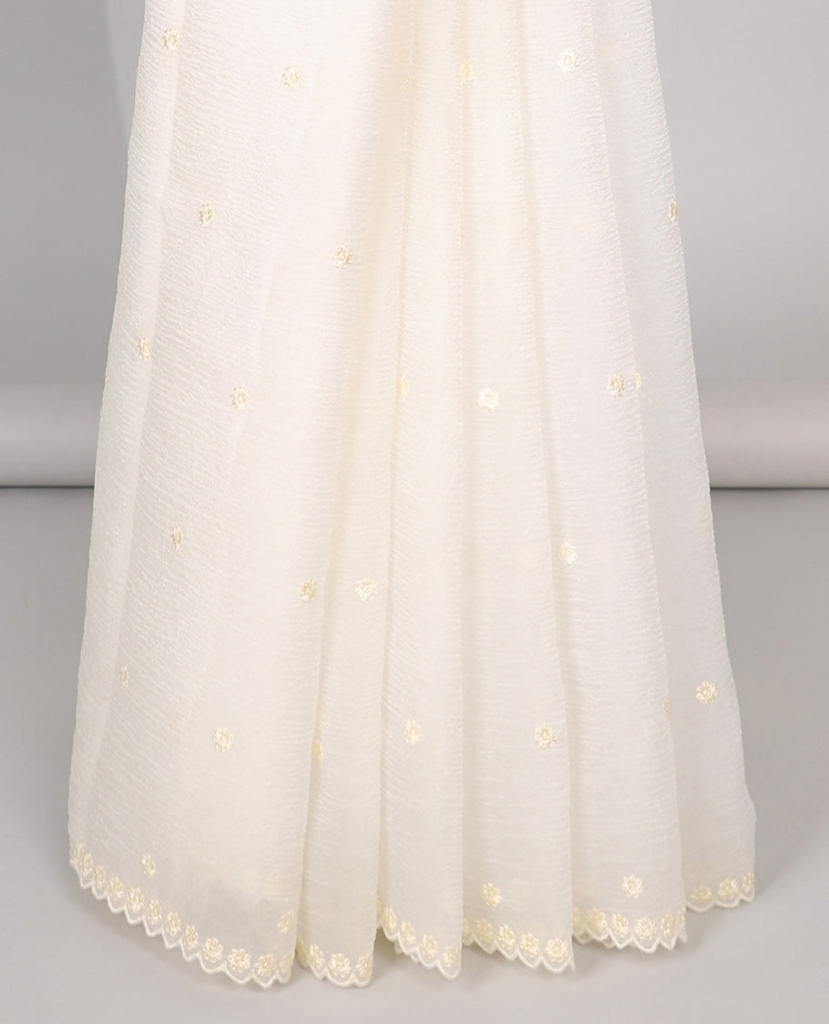 Pink Crushed Tissue saree with scallop motif border and intricate motif embroidery pallu