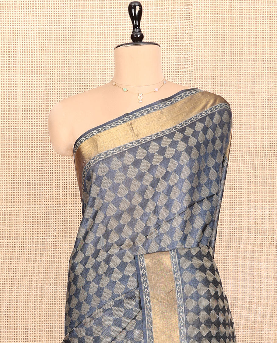 Grey Tussar Silk Saree, Subtly Steeped with Buttas, a Subtle Zari Border, Pallu Features Stripes and Buttas, and a Matching Blouse