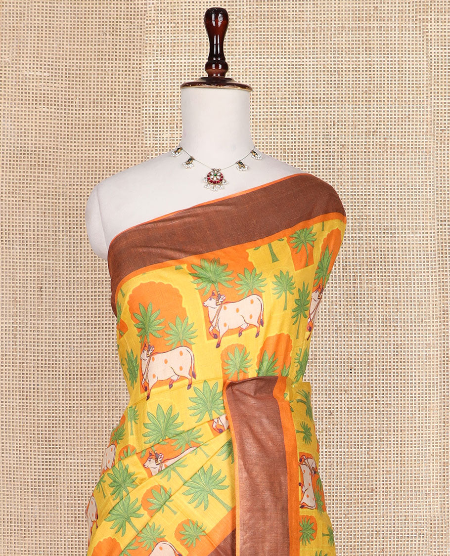 Yellow tree and Pichwai cow printed tussar silk saree, bavanji border, and checked pallu