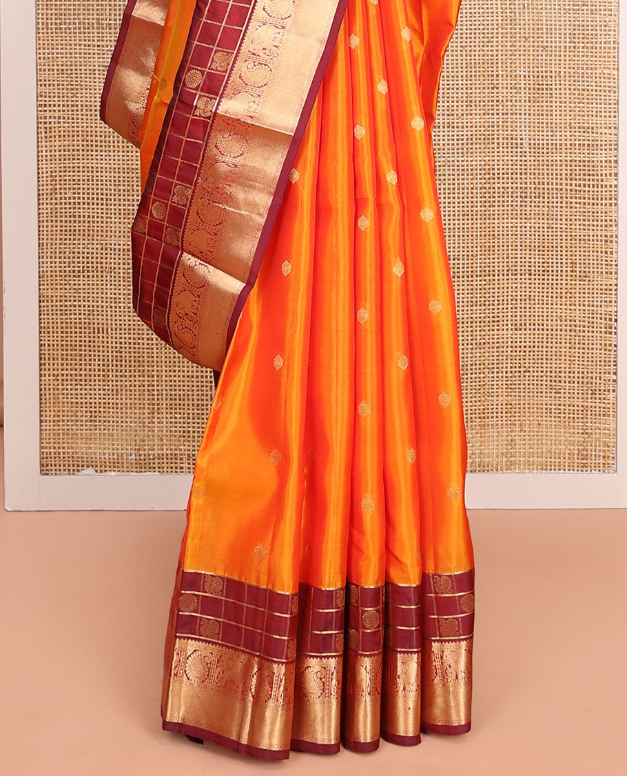 Orange Vasundhara Lite-Silk Mix Saree, Enthralled with Zari Buttas All Over Its Body, Complemented by a Contrast Annam Chakram Enclosed Checked Border of Kamalam, Manga, and Yaanai Designs, Grand Pallu of Jaal Designs, and Paired with a Contrast Blouse