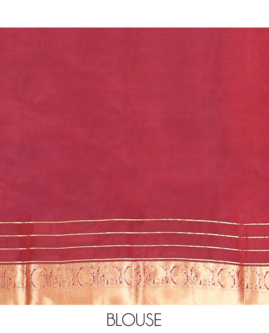 Orange Vasundhara Lite-Silk Mix Saree, Enthralled with Zari Buttas All Over Its Body, Complemented by a Contrast Annam Chakram Enclosed Checked Border of Kamalam, Manga, and Yaanai Designs, Grand Pallu of Jaal Designs, and Paired with a Contrast Blouse