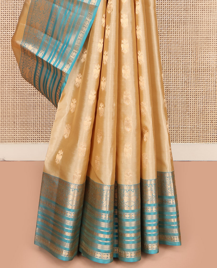 Gold Vasundhara Lite Silk Mix Saree, Bedecked with Iruthalai Pakshi Zari Buttas, Complemented by a Contrast Border of Rekku, Iruthalai Pakshi, Muthu, Laddu Kamalam, and Rudraksham, Opulently Embellished Pallu, and Paired with a Contrast Blouse