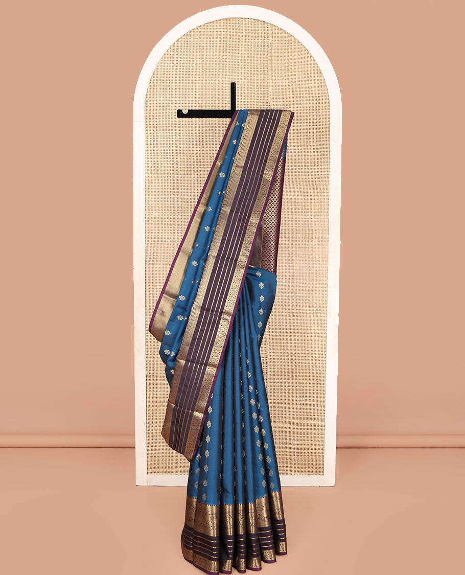 Blue Vasundhara Lite Silk Mix Saree, Mesmerized with Zari Buttas on Its Body, Complemented by a Contrast Varisai Pettu Border of Rekku, Muthu, Neli, Mayil, and Cross Kamalam Designs, Beautifully Bedecked Pallu, and Paired with a Contrast Blouse