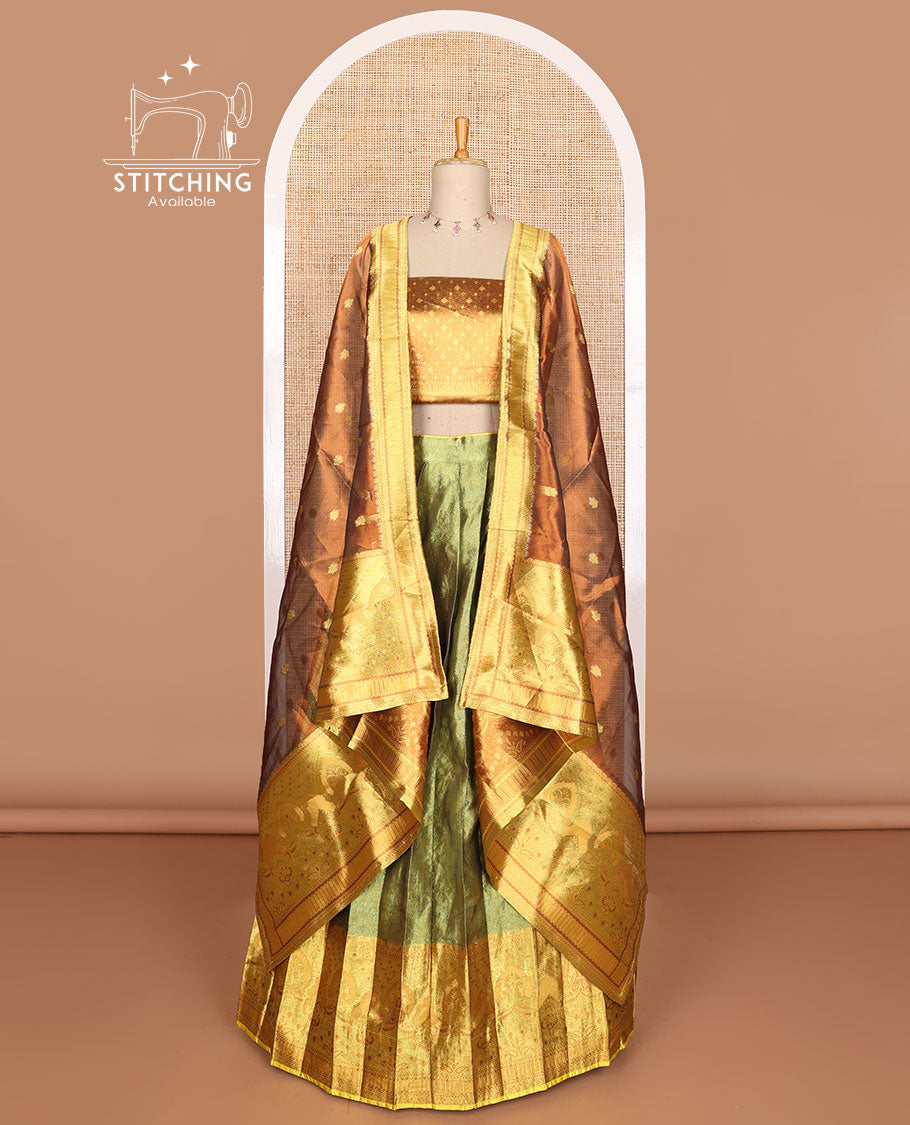 Green buttas tissue half saree with contrast zari design border, checked zari design blouse & floral design dhavani