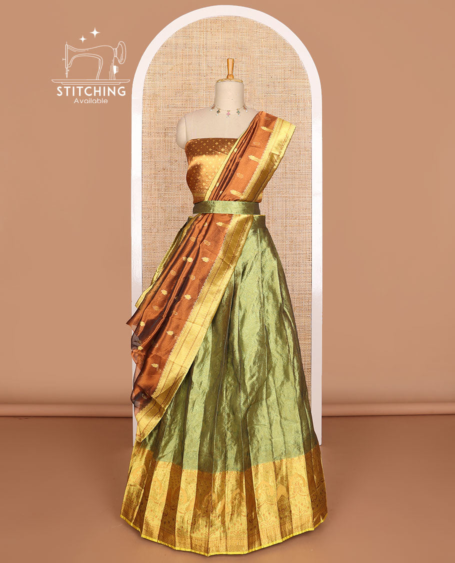 Green buttas tissue half saree with contrast zari design border, checked zari design blouse & floral design dhavani