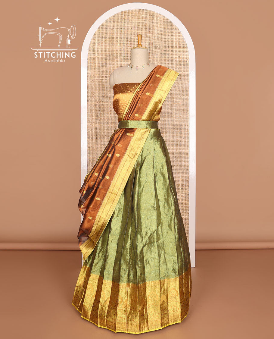 Green buttas tissue half saree with contrast zari design border, checked zari design blouse & floral design dhavani