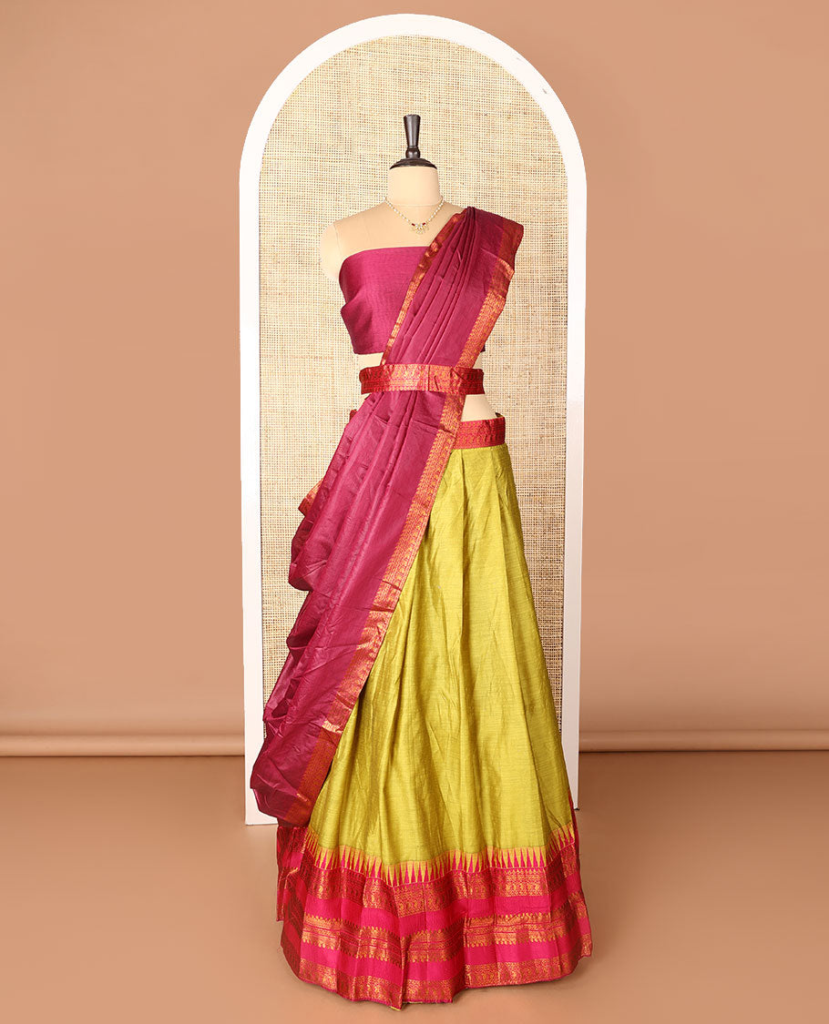 Green art-silk half-saree, plain with contrast temple traditional design bordered skirt, contrast blouse, and plain zari bordered dhavani