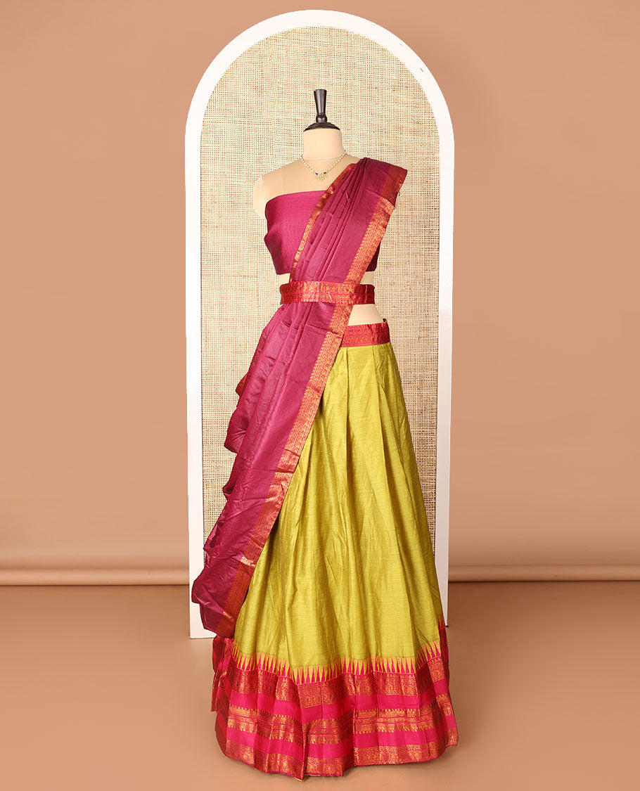 Green art-silk half-saree, plain with contrast temple traditional design bordered skirt, contrast blouse, and plain zari bordered dhavani