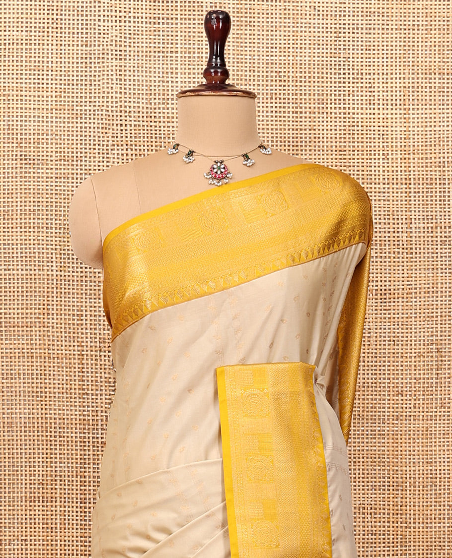 Biscuit-Yellow Budget Silk Saree, Subtly Sparkled with Zari Buttas, a Contrast Traditional Zari Border, Grand Pallu, and a Contrast Blouse