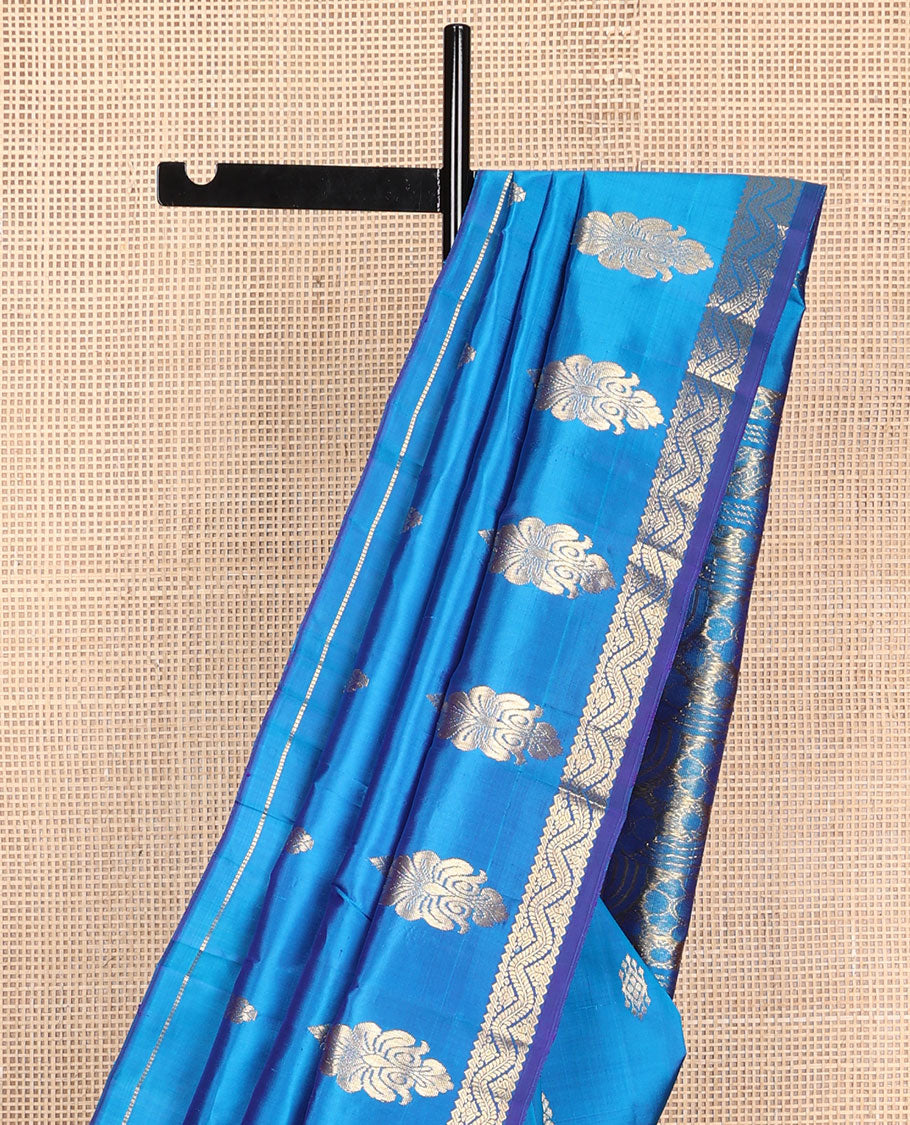 Blue zari buttas Kanchipuram silk saree, one-sided zari border of rekku, banaras, and neli designs, and floral design pallu