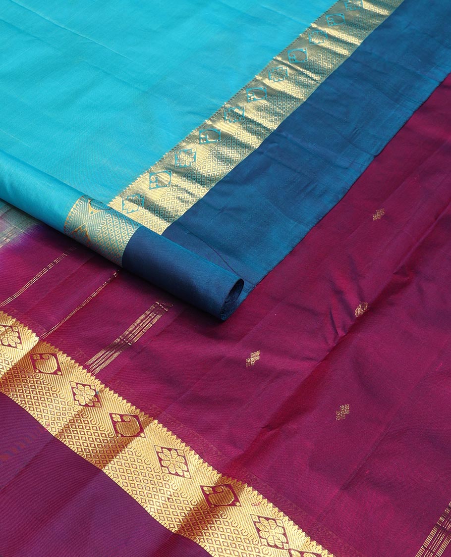 Blue zari buttas Kanchipuram silk saree, contrast border of thazampoo rekku,muthu,kamalam,manga, and kuyil kann, and zari design pallu
