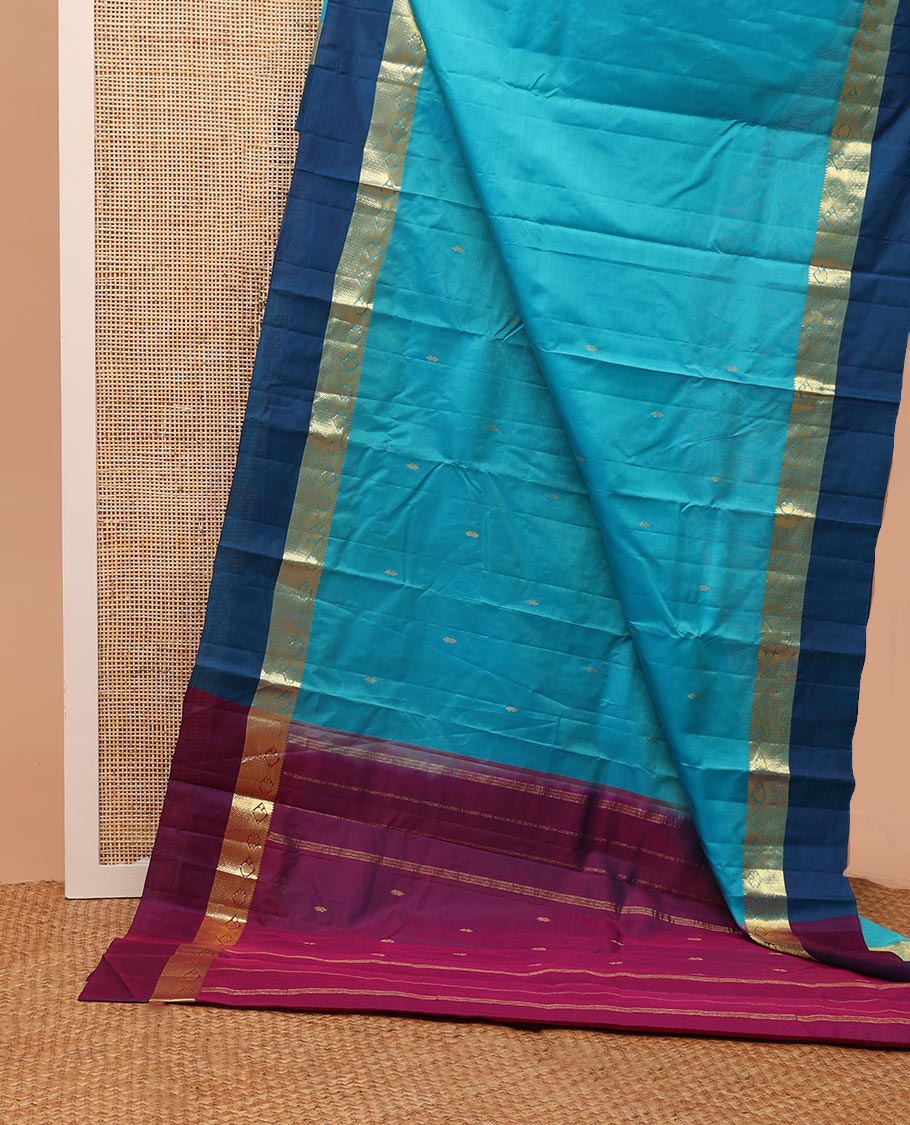 Blue zari buttas Kanchipuram silk saree, contrast border of thazampoo rekku,muthu,kamalam,manga, and kuyil kann, and zari design pallu