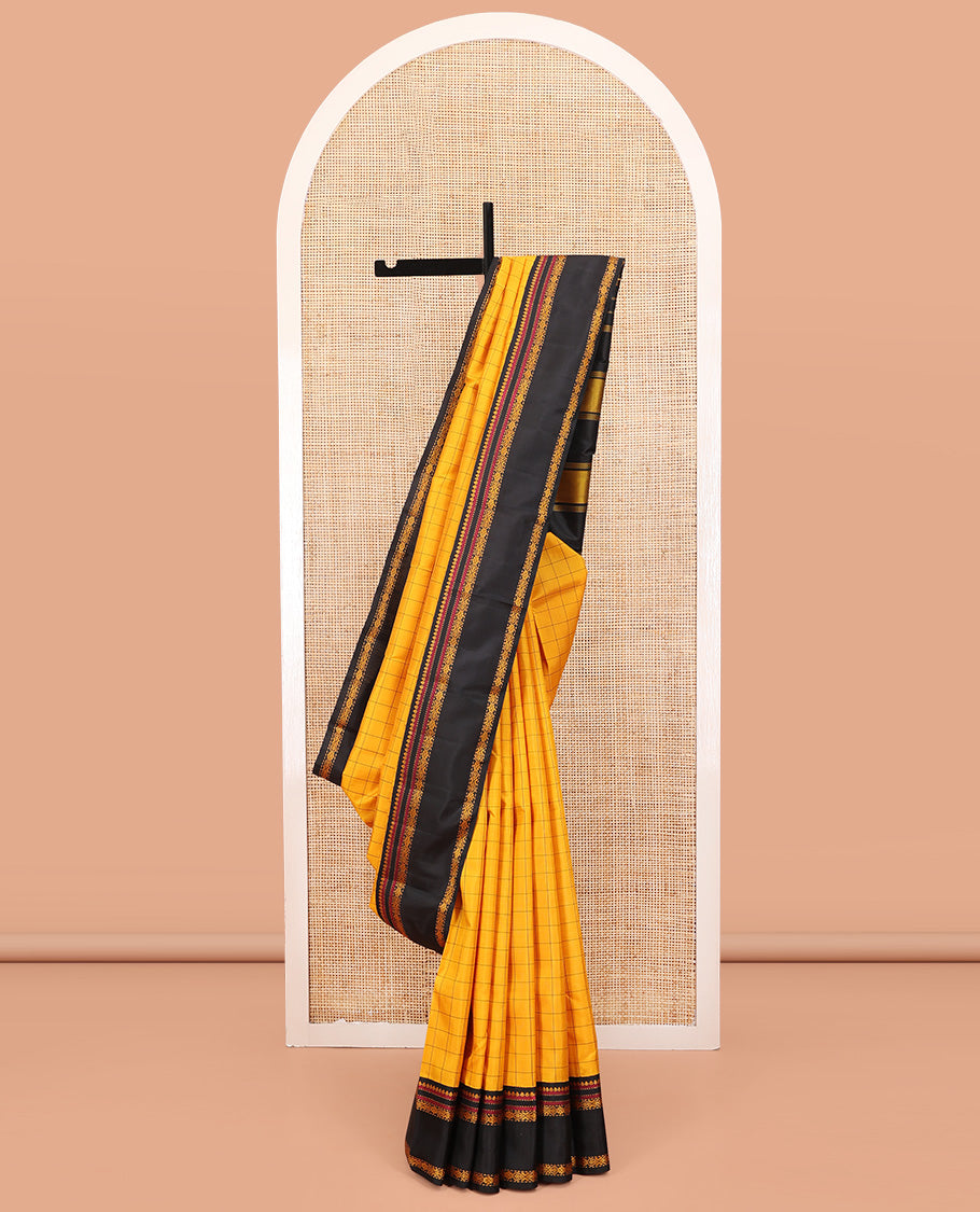 Yellow Kanchipuram Silk Saree, Sparsely Woven with Checked Design All Over Its Body, Complemented by a Contrast Rettai Pettu Border of Thilakam, Muthu, and Jada Nagam Designs, Pallu of Thazampoo Rekku Designs, and Paired with a Contrast Blouse