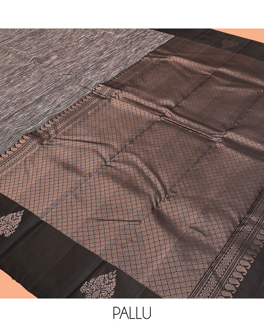 Black Kanchipuram Silk Saree, Decked Up with Ikat-Style Stripes, Highlighted By Floral Buttas Border, Grand Jaal Pallu, and a Matching Blouse