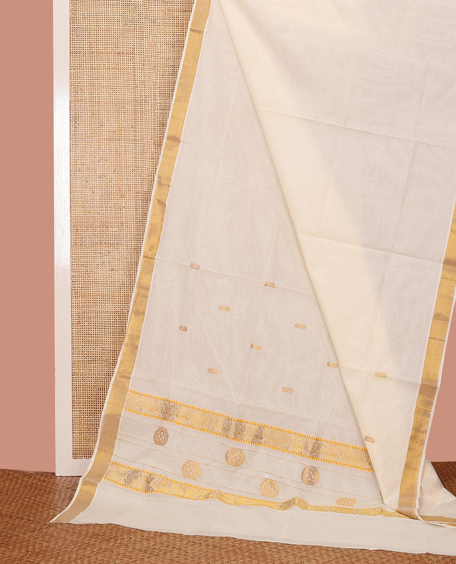 Cream Kerala Saree, Decorated with Zari Buttas on Its Body, Subtly Sparkled Bavanji Border, Pallu Zari Woven with Floral Designs, and Paired with a Matching Blouse