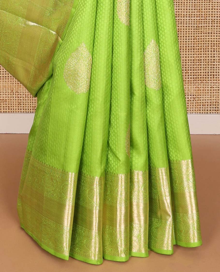 Green floral design silk saree with self border of thilakam mokku, paun, kodi visiry, banaras design & zari design pallu