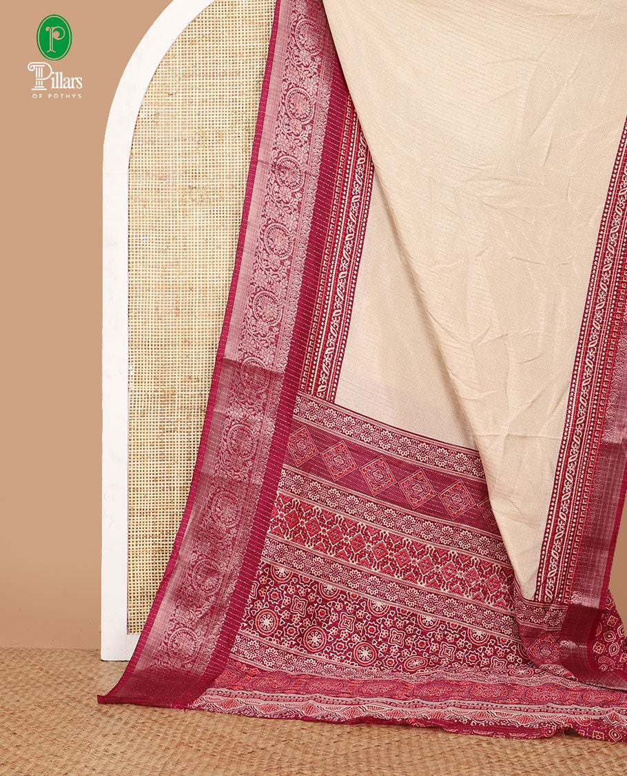 Cream vertical zari striped dola silk saree,contrast maroon traditional zari border & intricately Ajrakh printed pallu