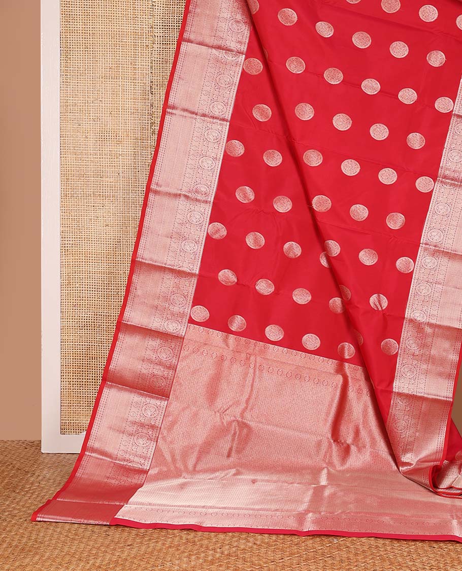 Red chakram zari buttas Vasundhara silk mix saree, zari border of rekku, cross kamalam, round mayil, chakram and then kuli kann and vanki design pallu