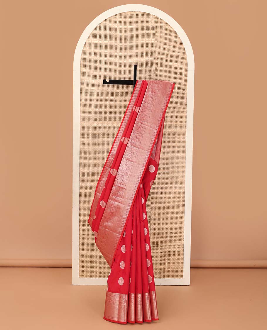 Red chakram zari buttas Vasundhara silk mix saree, zari border of rekku, cross kamalam, round mayil, chakram and then kuli kann and vanki design pallu