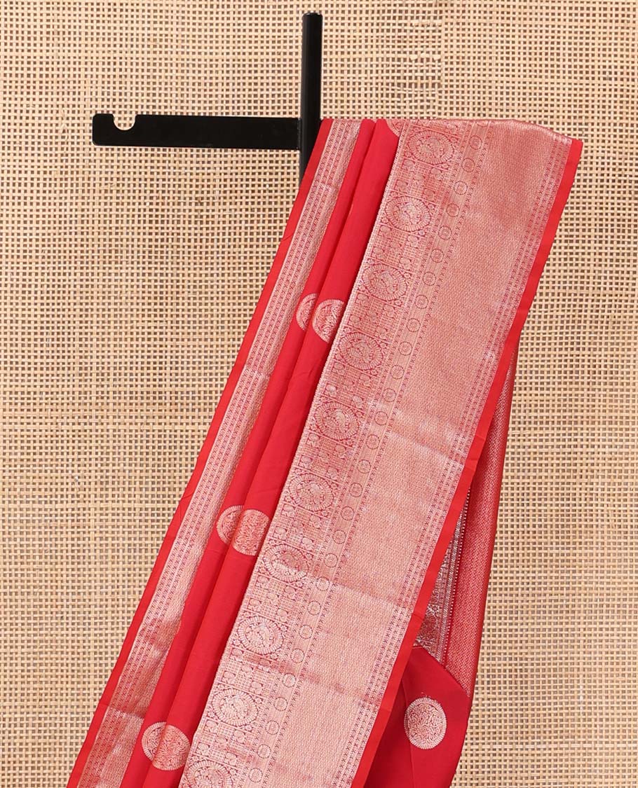Red chakram zari buttas Vasundhara silk mix saree, zari border of rekku, cross kamalam, round mayil, chakram and then kuli kann and vanki design pallu