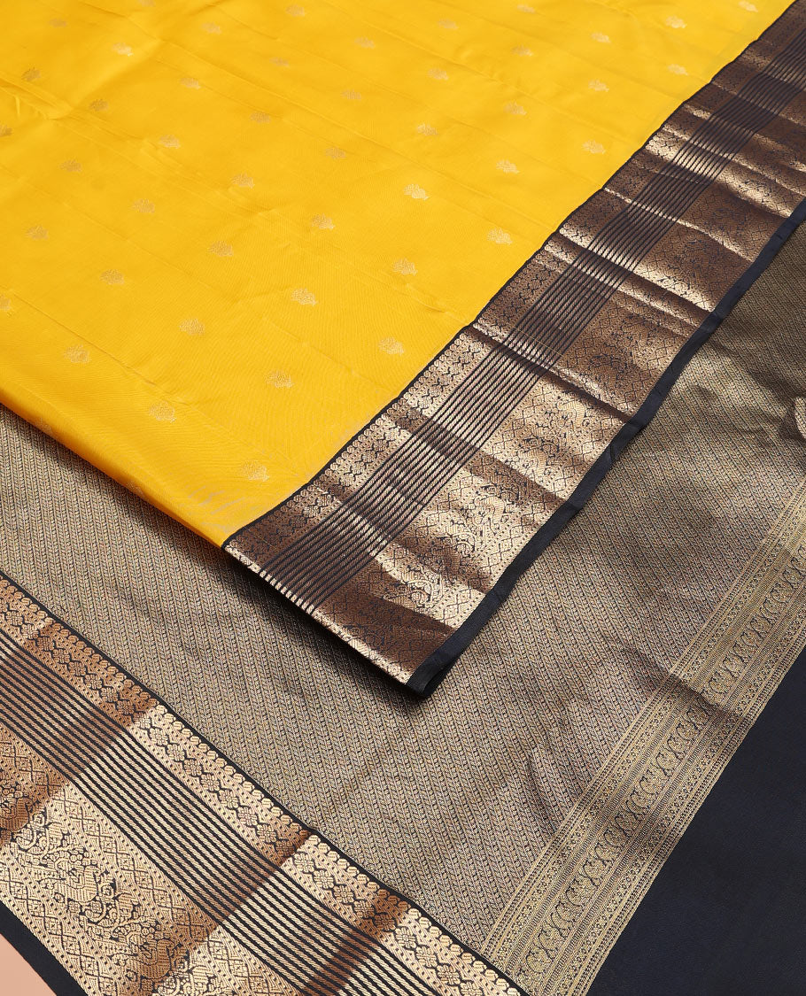 Yellow Vasundhara Lite-Silk Mix Saree Decked Up with Zari Buttas, Complemented by a Contrast Black Border Depicting Manga, Muthu, Kamalam, Banaras, Diamond, and Mayil Designs, Pallu Steeped with Diagonal Leaf Vines, and a Contrast Blouse