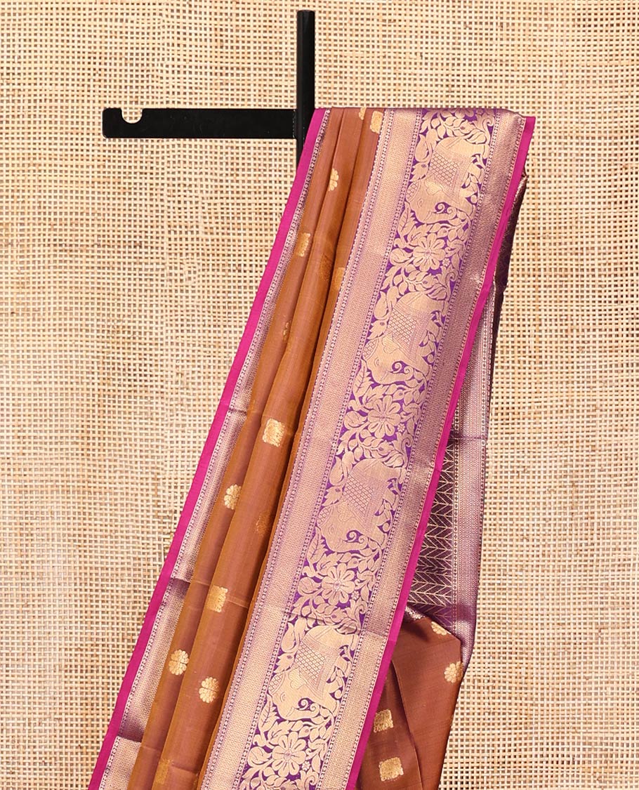 Brown Vasundhara Lite Silk Mix Saree, Subtly Sparkled With Zari Buttas All Over Its Body, Complemented by Mayil Kann And Yaanai Designs, Grand Jaal Pallu and Paired with a Contrast Blouse