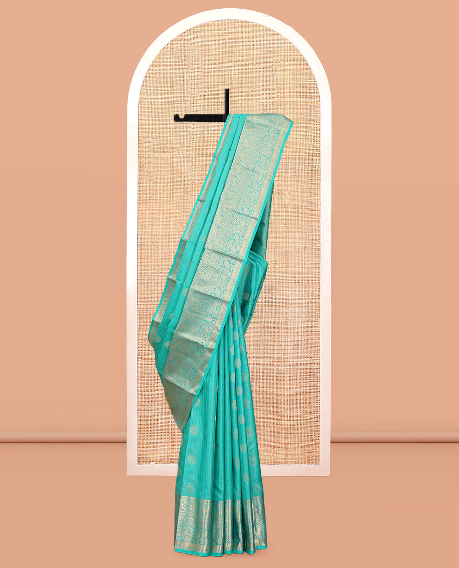 Blue Vasundhara Silk Saree, Accentuated with Zari Buttas and Stripes, a Zari Border of Kathir, Yaanai, Rudraksham, Manga, and Mayil Design, a Grand Pallu, and a Matching Blouse