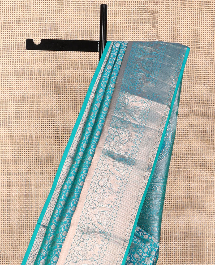 Blue jacquard wedding silksaree,zari border of thilakam mokku,laddu kamalam,singam,mayil chakram & jaal design & intricate pallu