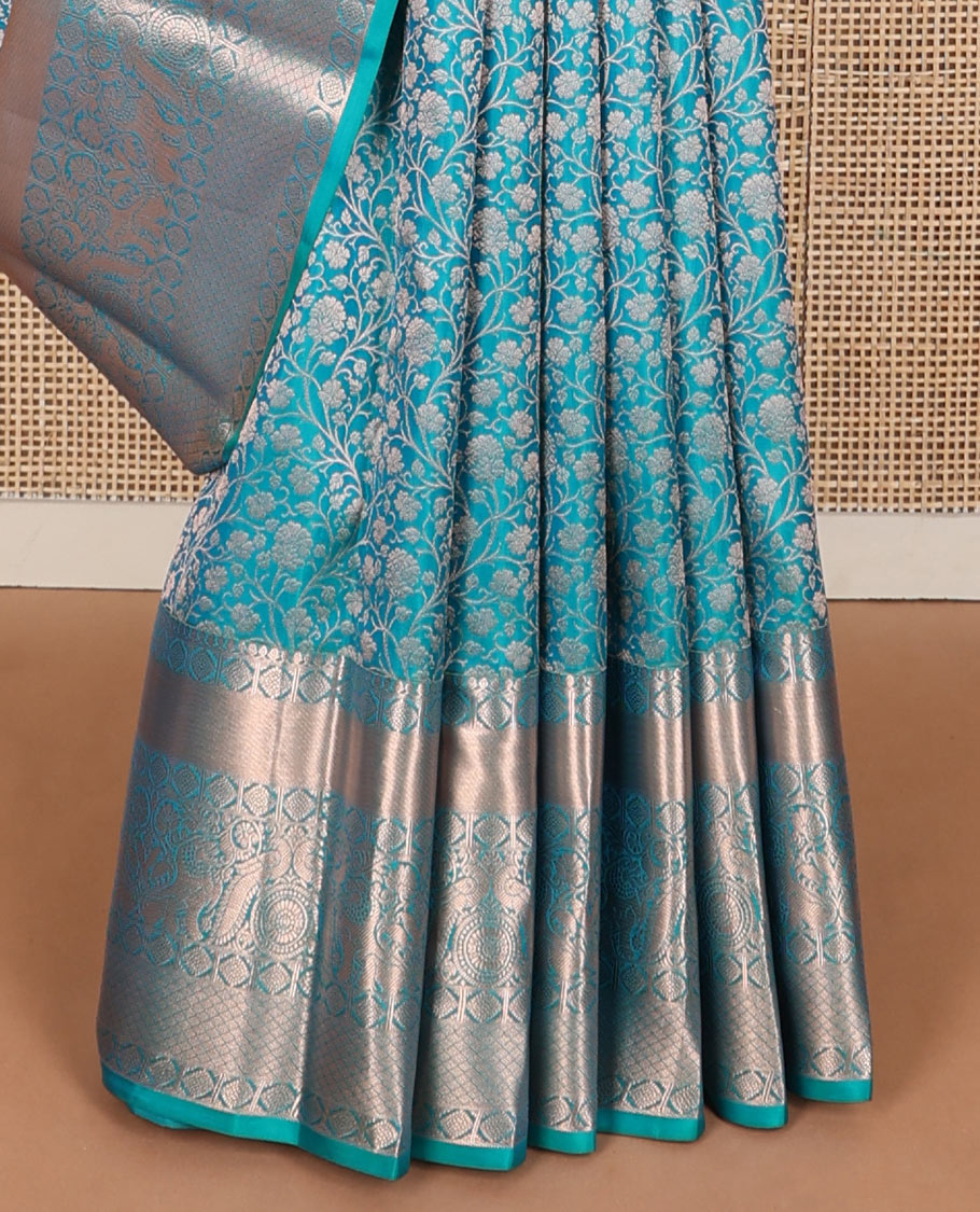 Blue jacquard wedding silksaree,zari border of thilakam mokku,laddu kamalam,singam,mayil chakram & jaal design & intricate pallu