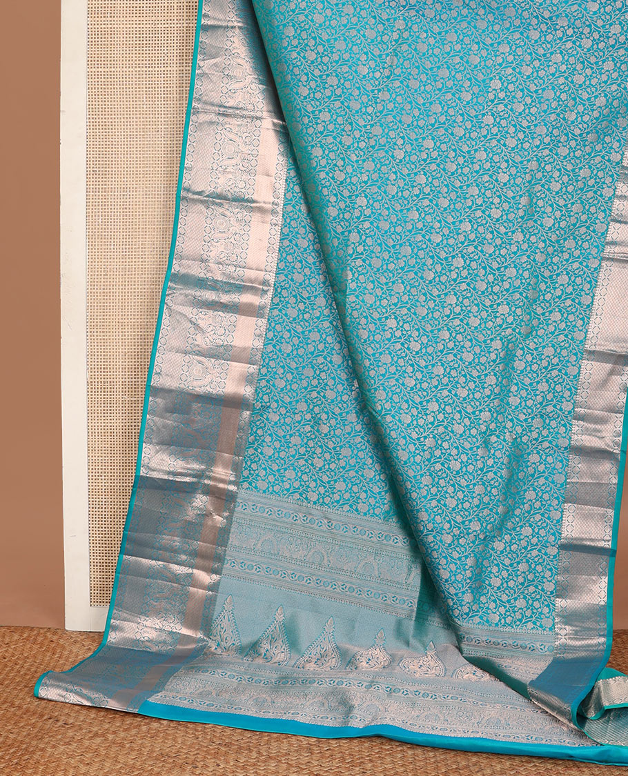 Blue jacquard wedding silksaree,zari border of thilakam mokku,laddu kamalam,singam,mayil chakram & jaal design & intricate pallu