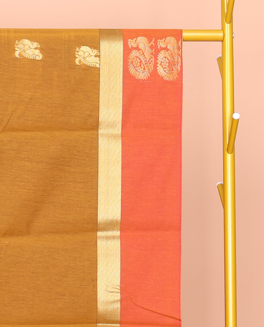Mustard Semi-Silk Cotton Saree, Ornamented with Peacock Buttas All Over Its Body, Complemented by a Contrast Border of Peacock Designs, Pallu Steeped with Peacock Designs, and Paired with a Contrast Blouse