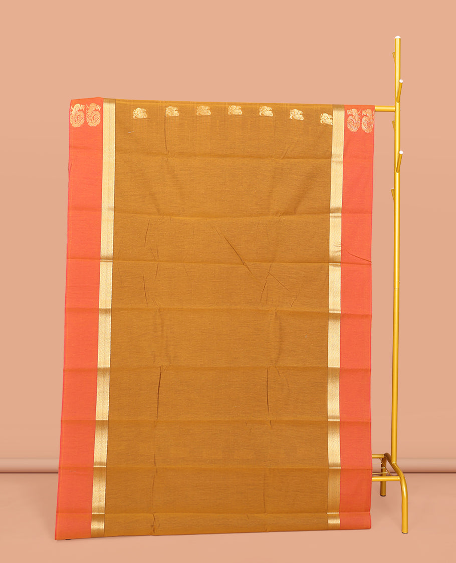 Mustard Semi-Silk Cotton Saree, Ornamented with Peacock Buttas All Over Its Body, Complemented by a Contrast Border of Peacock Designs, Pallu Steeped with Peacock Designs, and Paired with a Contrast Blouse