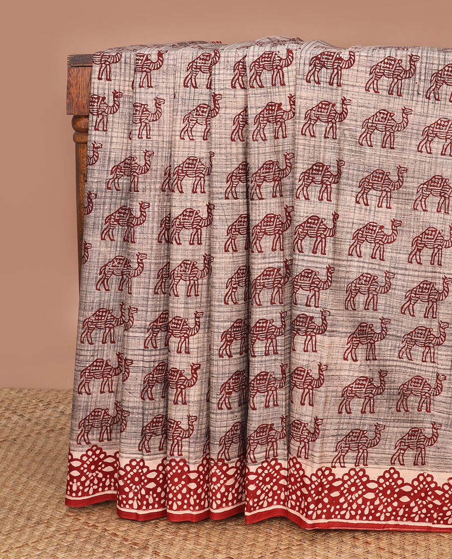 Brown camel motifs printed mul mul cotton saree, contrast block printed border & pallu of floral-geometric block print