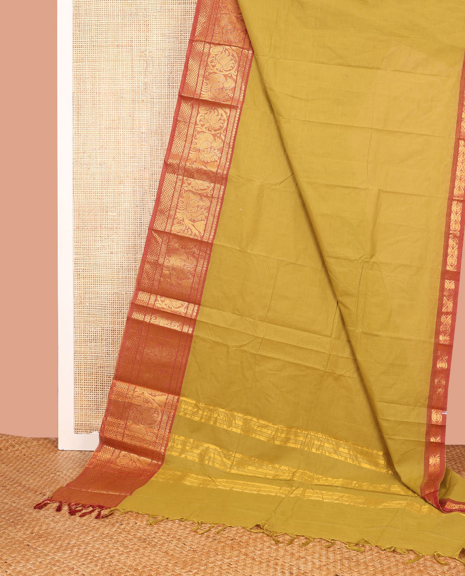 Mustard Plain Chettinad Cotton Saree, Complemented by a Contrast Traditional Zari Border of Peacock Designs, a Pallu of Zari Stripes, and Paired with a Matching Blouse