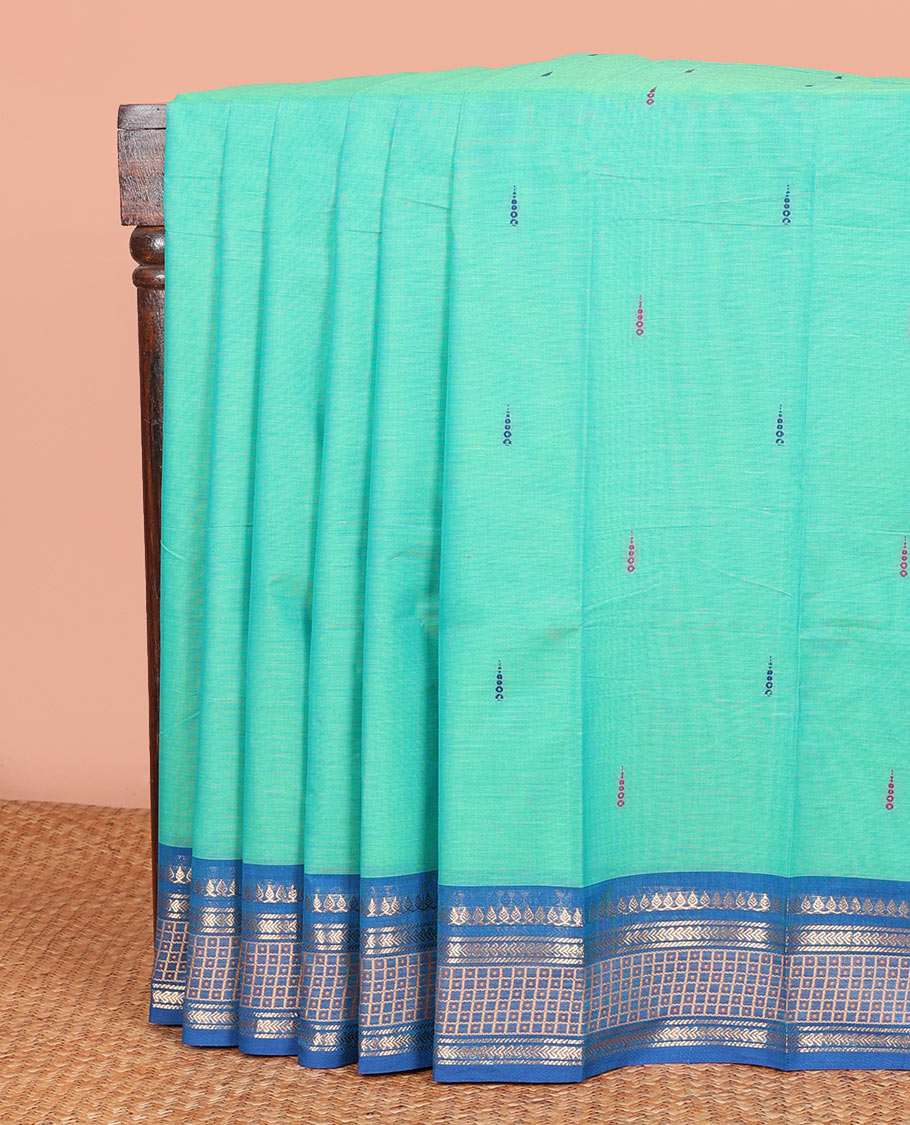 Turquoise Chettinad Cotton Saree Subtly Woven with Thread Buttas on Its Body, Complemented by a Contrast Traditional Design Woven Zari Border, Subtly Striped Pallu, and Paired with a Matching Blouse