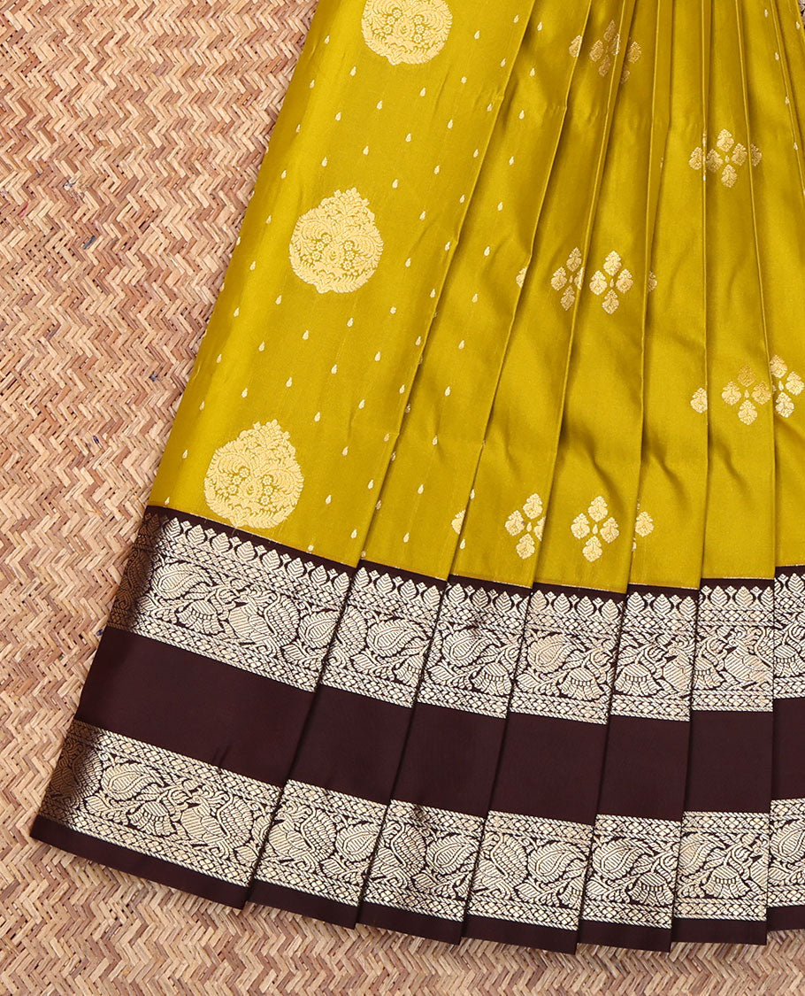 Green Budget Silk Saree, Ornamented with Zari Buttas All Over Its Body, Complemented by Contrast Traditional Zari Design Rettai Pettu Border, Geometric-Patterned Pallu, and Paired with a Contrast Blouse