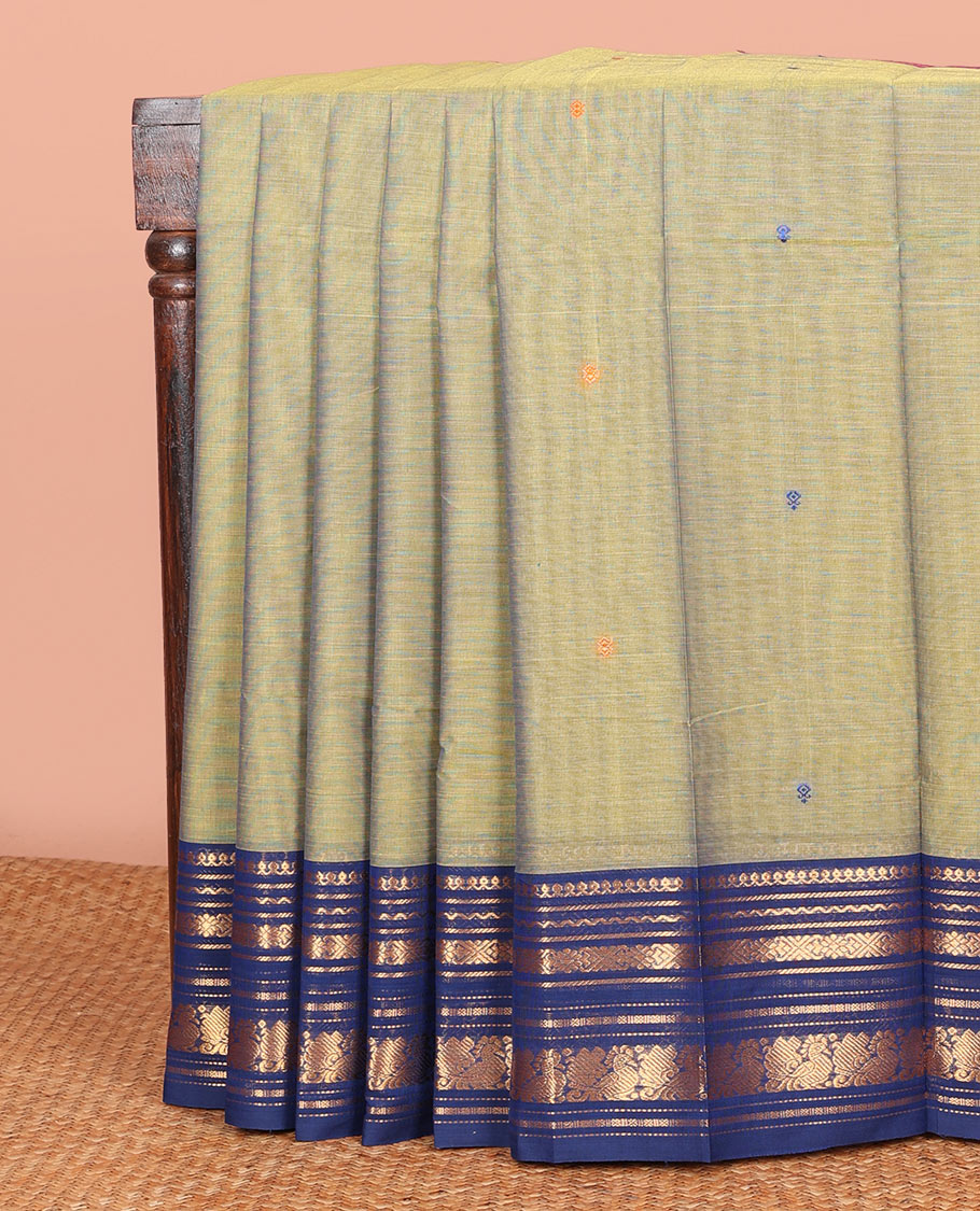 Green Chettinad Cotton Saree Prettified with Thread Buttas All Over Its Body, Complemented by Contrast Ganga-Jamuna Border of Traditional Zari Designs, Pallu of Subtle Stripes and Buttas, and Paired with a Matching Blouse