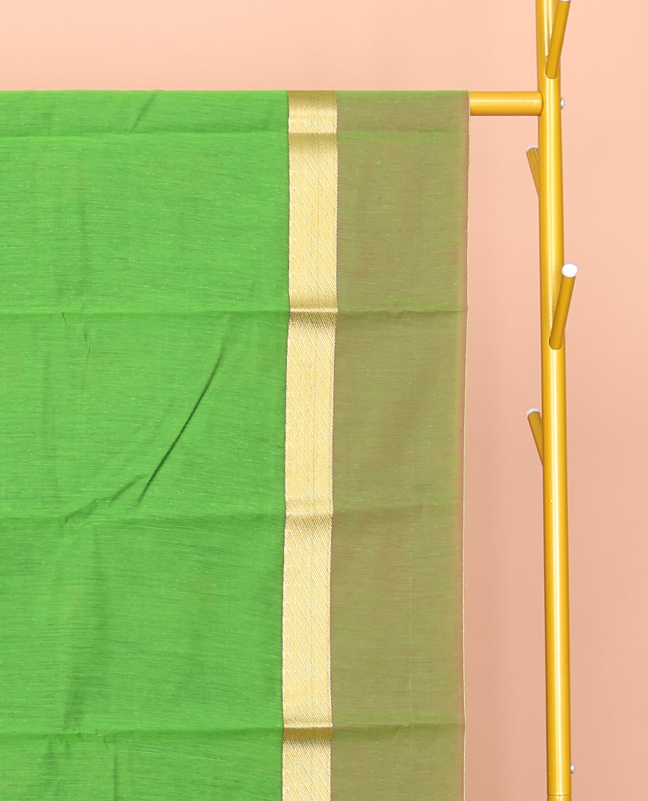 Green Semi-Silk Cotton Saree, Decked Up with Peacock Buttas All Over Its Body, Highlighted by a Zari Border, Pallu Artfully Woven with Peacock Designs, and Paired with a Contrast Blouse