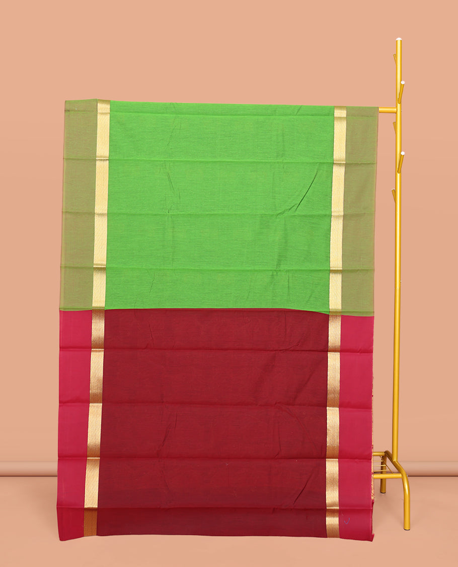 Green Semi-Silk Cotton Saree, Decked Up with Peacock Buttas All Over Its Body, Highlighted by a Zari Border, Pallu Artfully Woven with Peacock Designs, and Paired with a Contrast Blouse