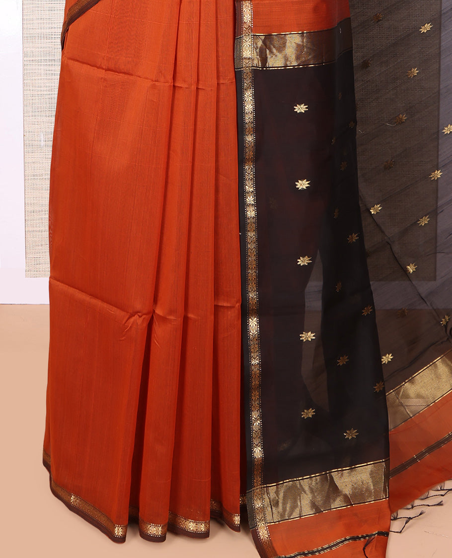 Orange Maheshwari Cotton Saree, Adorned with Buttas, a Subtle Contrast Piping Border, Pallu Gleamed Up with Zari Buttas, and a Contrast Blouse