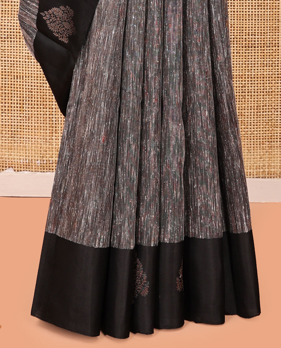 Black Kanchipuram Silk Saree, Decked Up with Ikat-Style Stripes, Highlighted By Floral Buttas Border, Grand Jaal Pallu, and a Matching Blouse