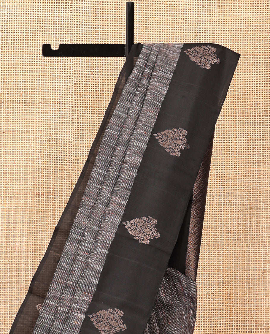 Black Kanchipuram Silk Saree, Decked Up with Ikat-Style Stripes, Highlighted By Floral Buttas Border, Grand Jaal Pallu, and a Matching Blouse