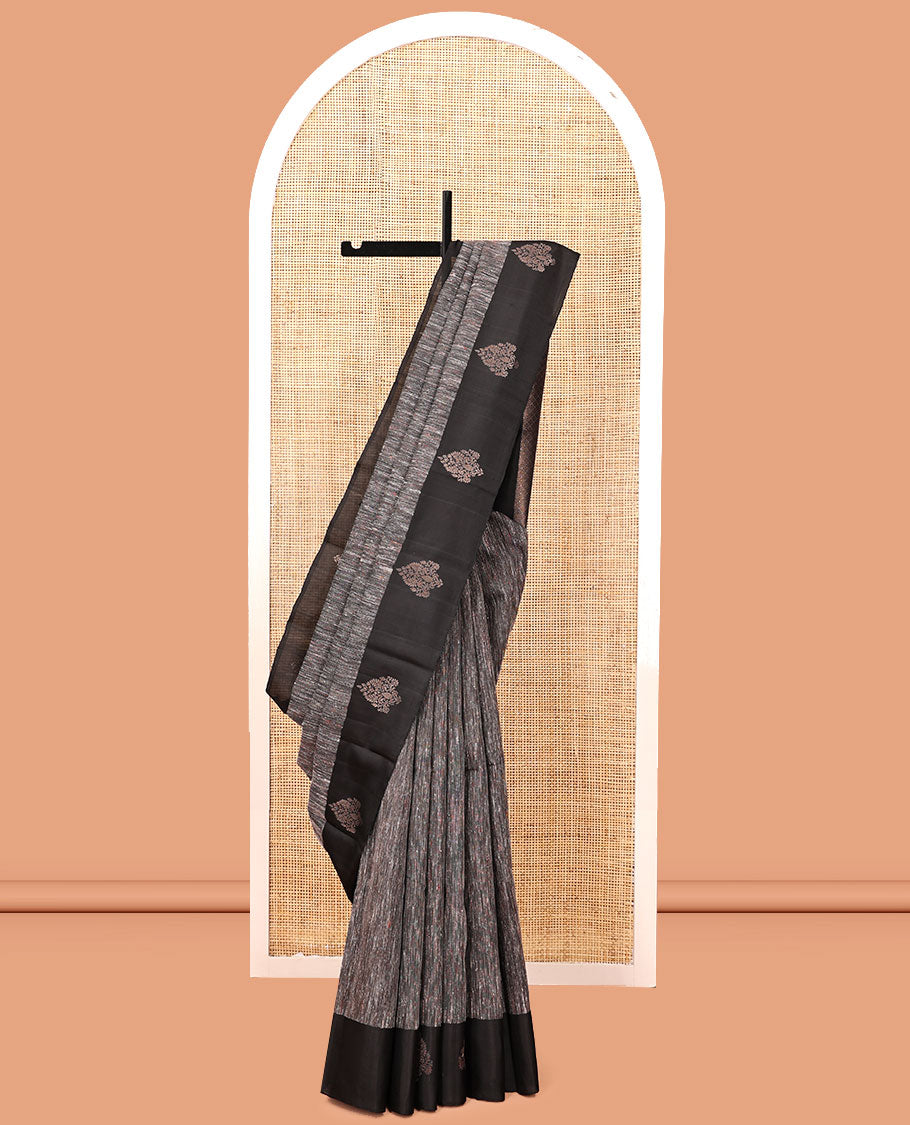 Black Kanchipuram Silk Saree, Decked Up with Ikat-Style Stripes, Highlighted By Floral Buttas Border, Grand Jaal Pallu, and a Matching Blouse