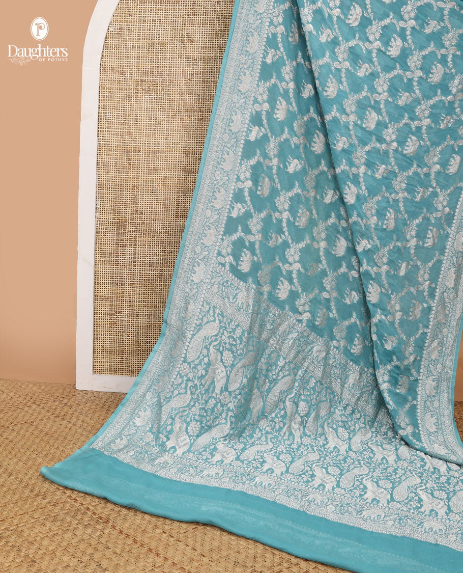 Blue floral jaal, animal design banaras silk saree with self zari design & forest theme pallu