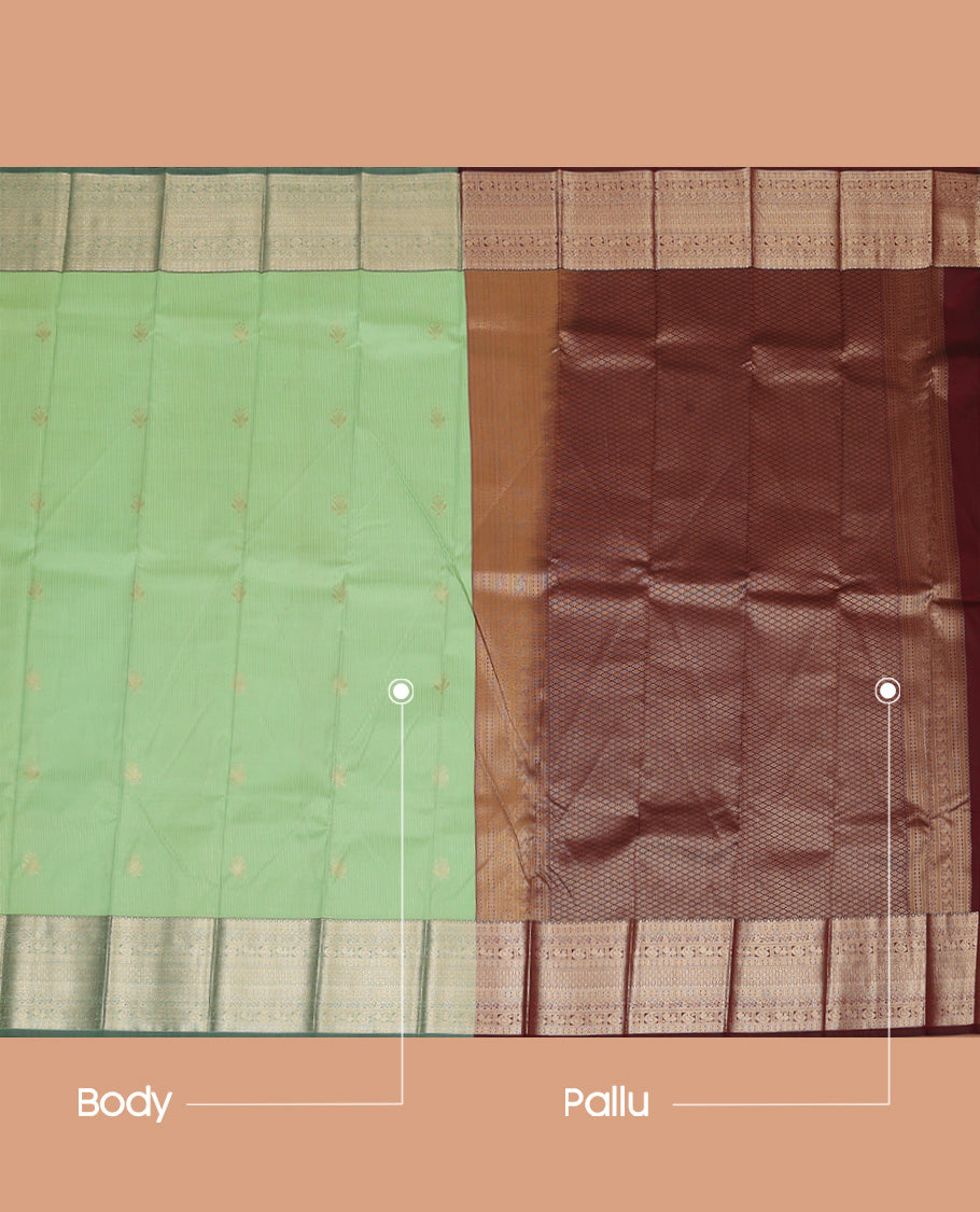 Pista Green Budget Silk Saree Subtly Sparkled With Zari Buttas and Stripes All Over Its Body, Complemented by Contrast Traditional Zari Designs Woven Border, Grandly Decked Up Pallu and Paired with a Contrast Blouse