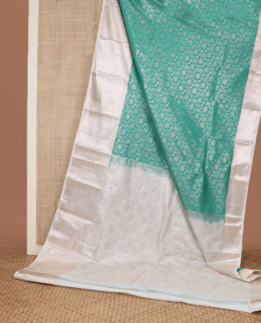 Turquoise Blue floral jaal jacquard budget silk saree, contrast traditional zari border, and intricate pallu