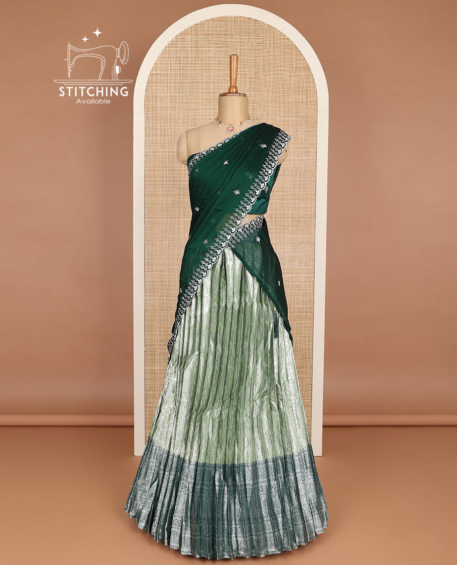 Green floral jacquard half saree with contrast intricate zari border, embroidered blouse & floral embroidery scallop border dhavani