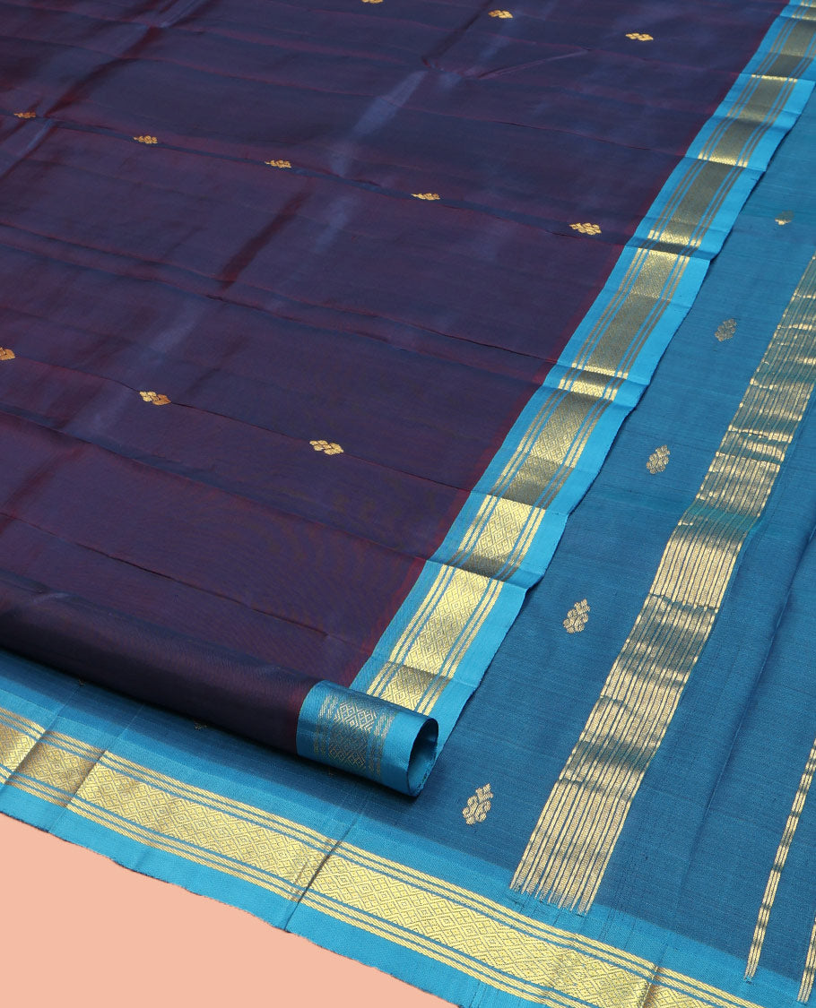 Navy Blue Kanchipuram Silk Saree, Beautifully Bedecked with Zari Buttas on Its Body, Complemented by Contrast One-Sided Border of Banaras, and Jaal Designs, Pallu Features Zari Designs, and Comes Without a Blouse