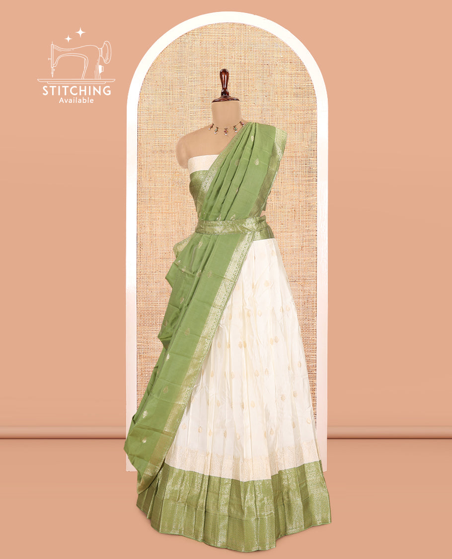 Cream-Olive Green Semi-Silk Half-Saree, Subtly Sparkled with Zari Buttas Skirt, a Contrast Traditional Zari Border, and a Contrast Dhavani