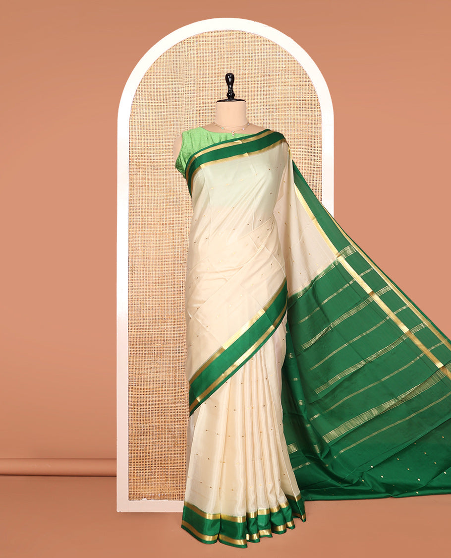 Cream Mysore Silk Saree, Embellished with Buttas, Complemented by a Contrast Traditional Zari Border, Zari Design Pallu, and a Contrast Blouse
